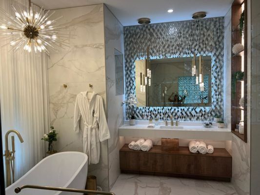 Restored primary bathroom with freestanding tub after residential fire damage repair in Orlando