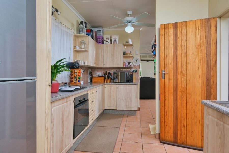 Clean kitchen interior before water damage from a refrigerator water line leak