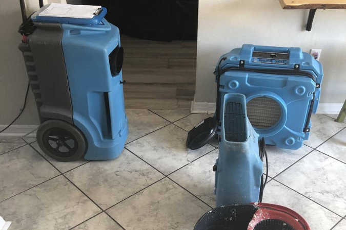 Water damage restoration equipment set up to dry out a flooded Central Florida home