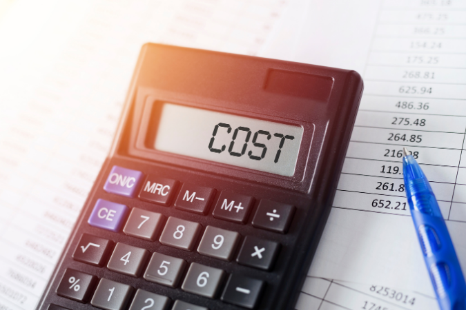The word cost shown on a calculator, representing water damage repair pricing in Lake County