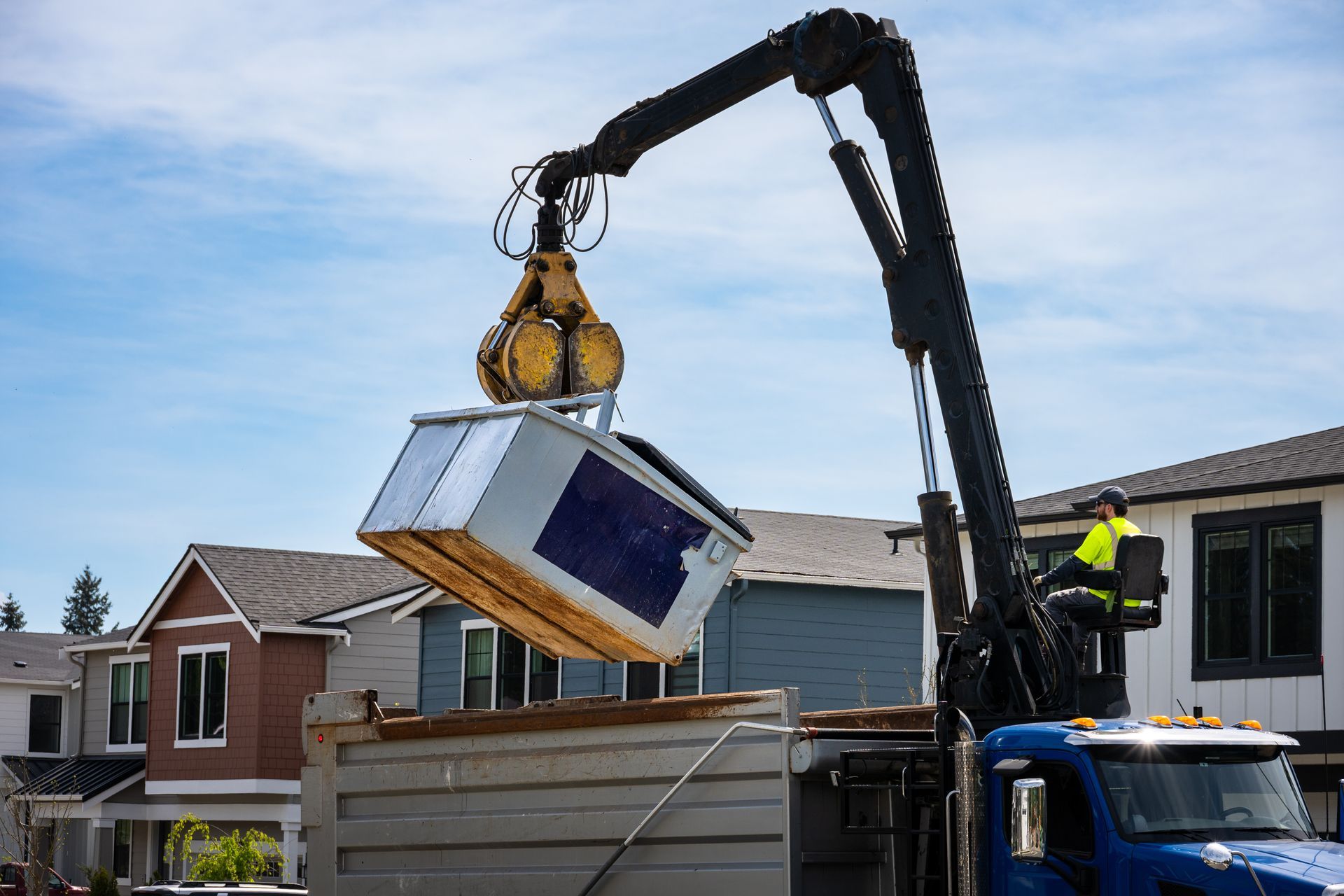 Workers loading renovation debris