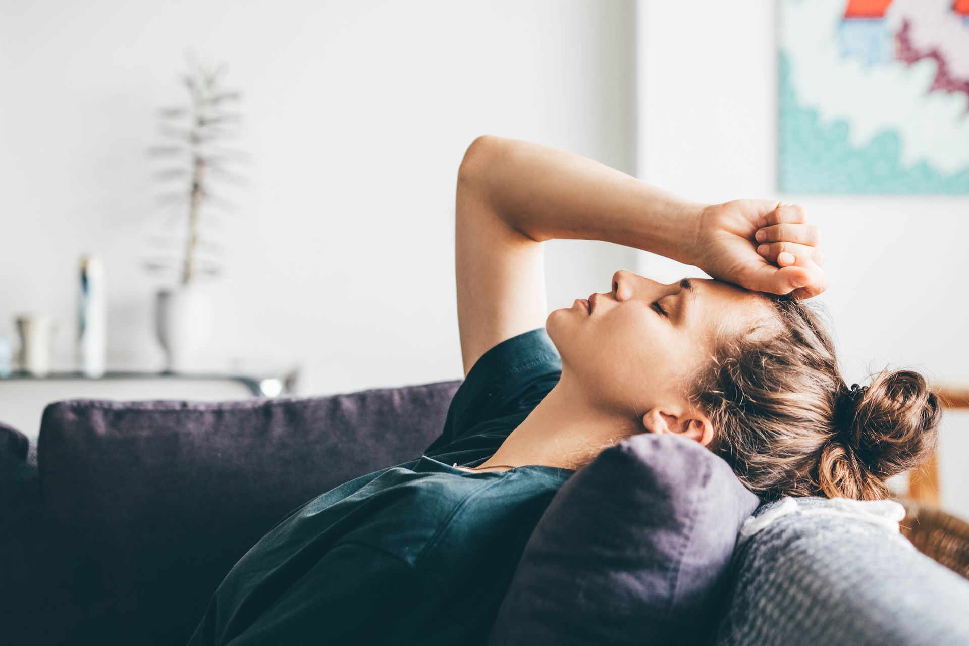 A Woman Laying on a Couch - Minnetonka, MN - Mobile Wellness