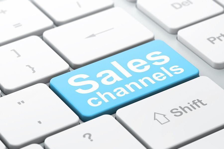 Blue keyboard key labeled “Sales channels” among white keys