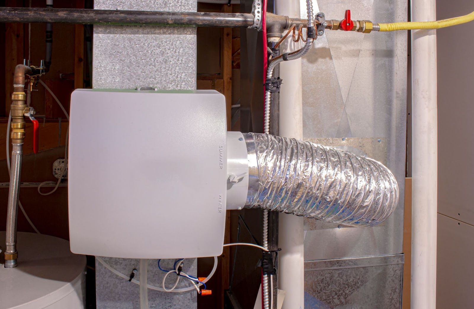 There is a ventilation system in the basement of a house.