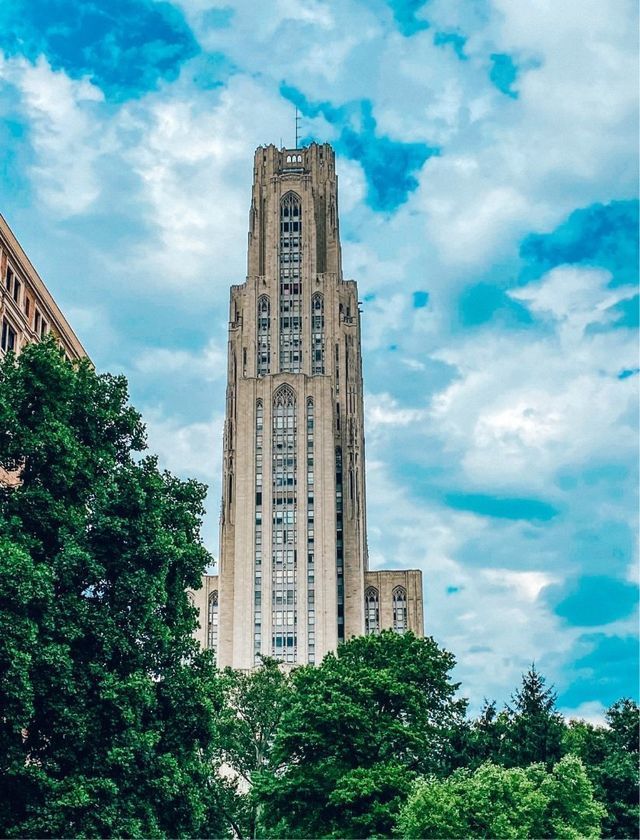 a tall building with a blue sky in the background