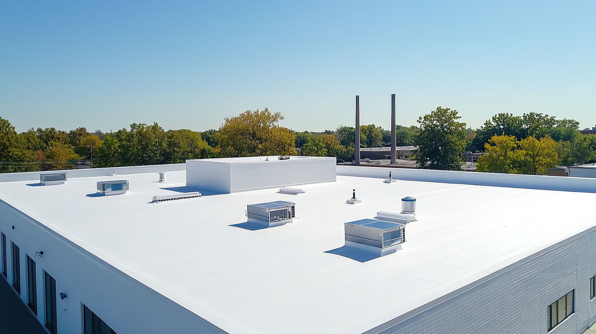Flat commercial roof with HVAC systems — W. C. Louis Roofing installs and repairs TPO and EPDM