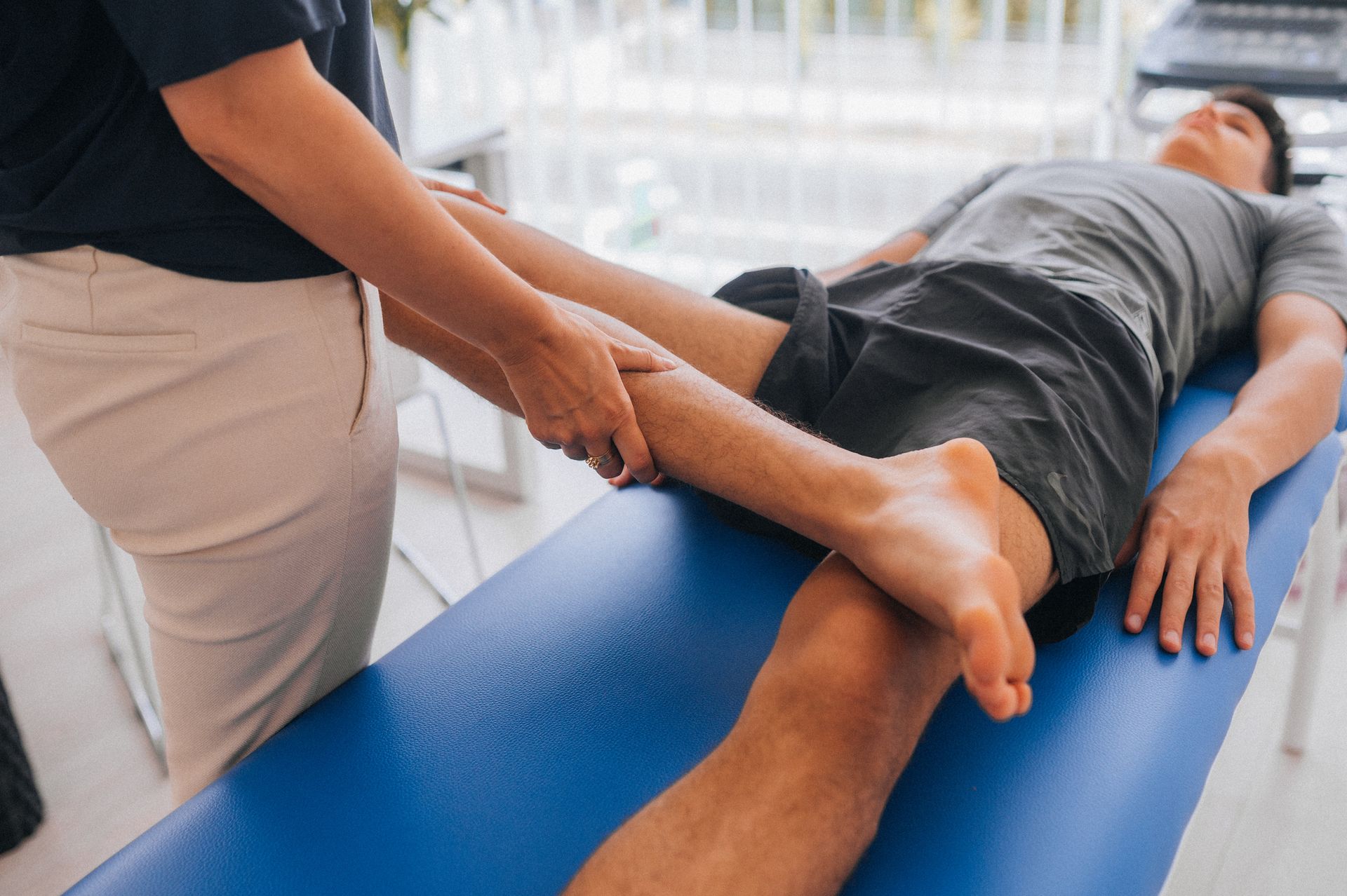 Therapist Helping A Woman With Her Exercise — Burien, WA — Southwest Seattle Physical Therapy & Sports Rehabilitation