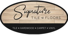 Signature Tile + Floors logo: oval design with woodgrain background and black text.