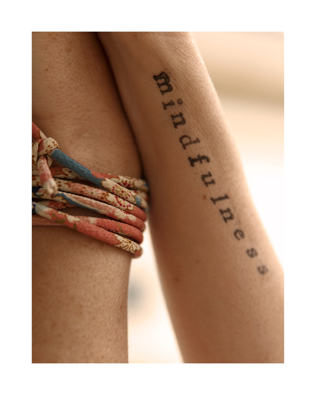 Tattoo on arm that reads