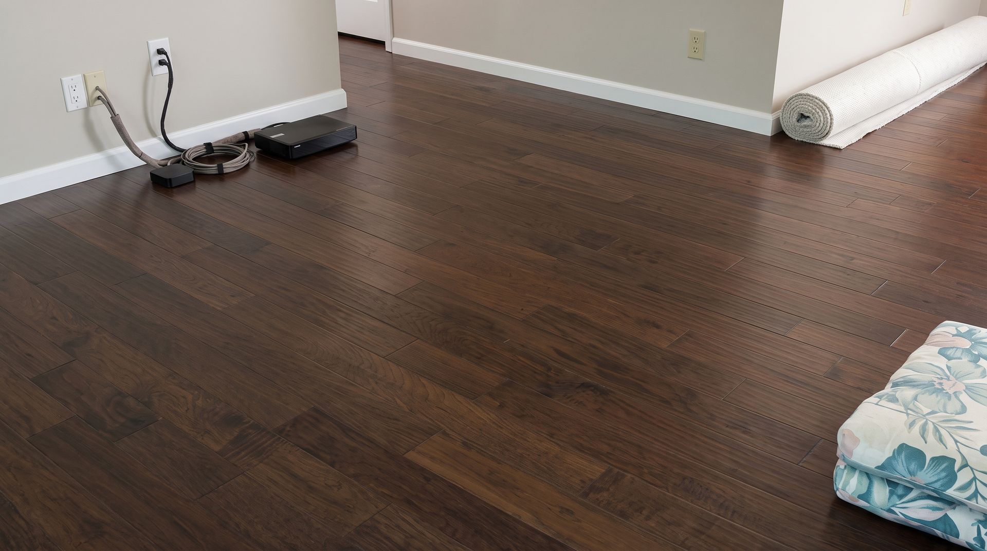 Microfiber mop cleaning a hardwood floor in a bright room