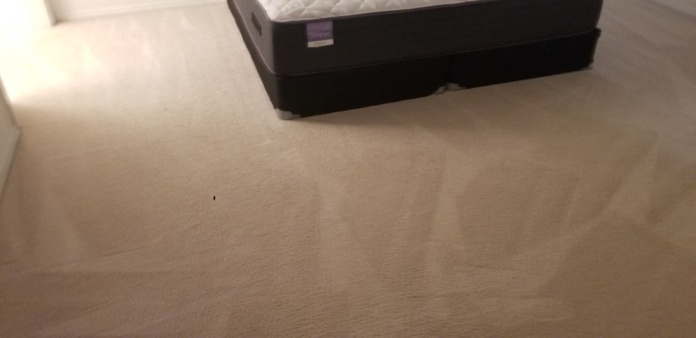 Beige floor with a black rectangular box near the top center
