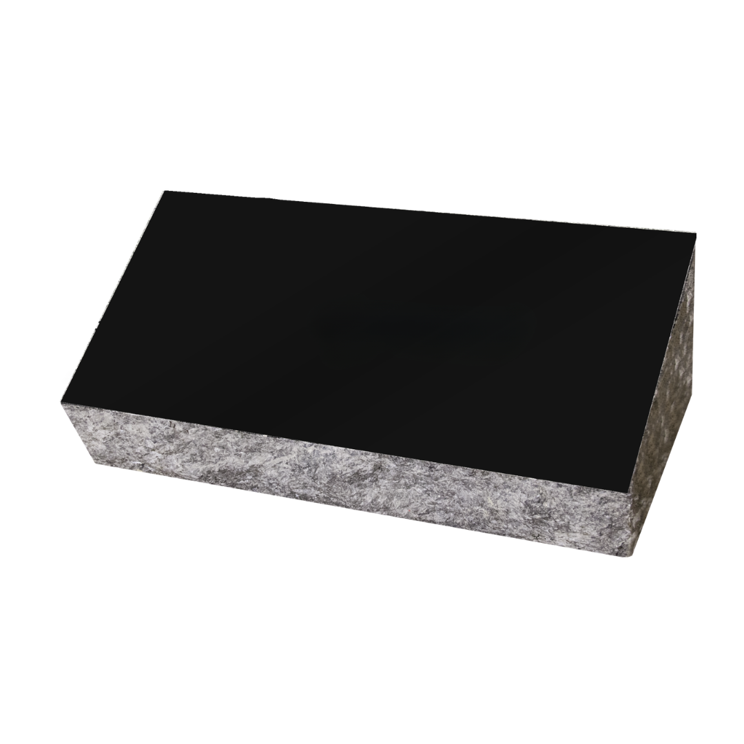 Black rectangular slab with a rough gray edge on a white background