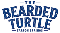 Logo for The Bearded Turtle, featuring a smiling pirate turtle with parrots in Tarpon Springs, FL