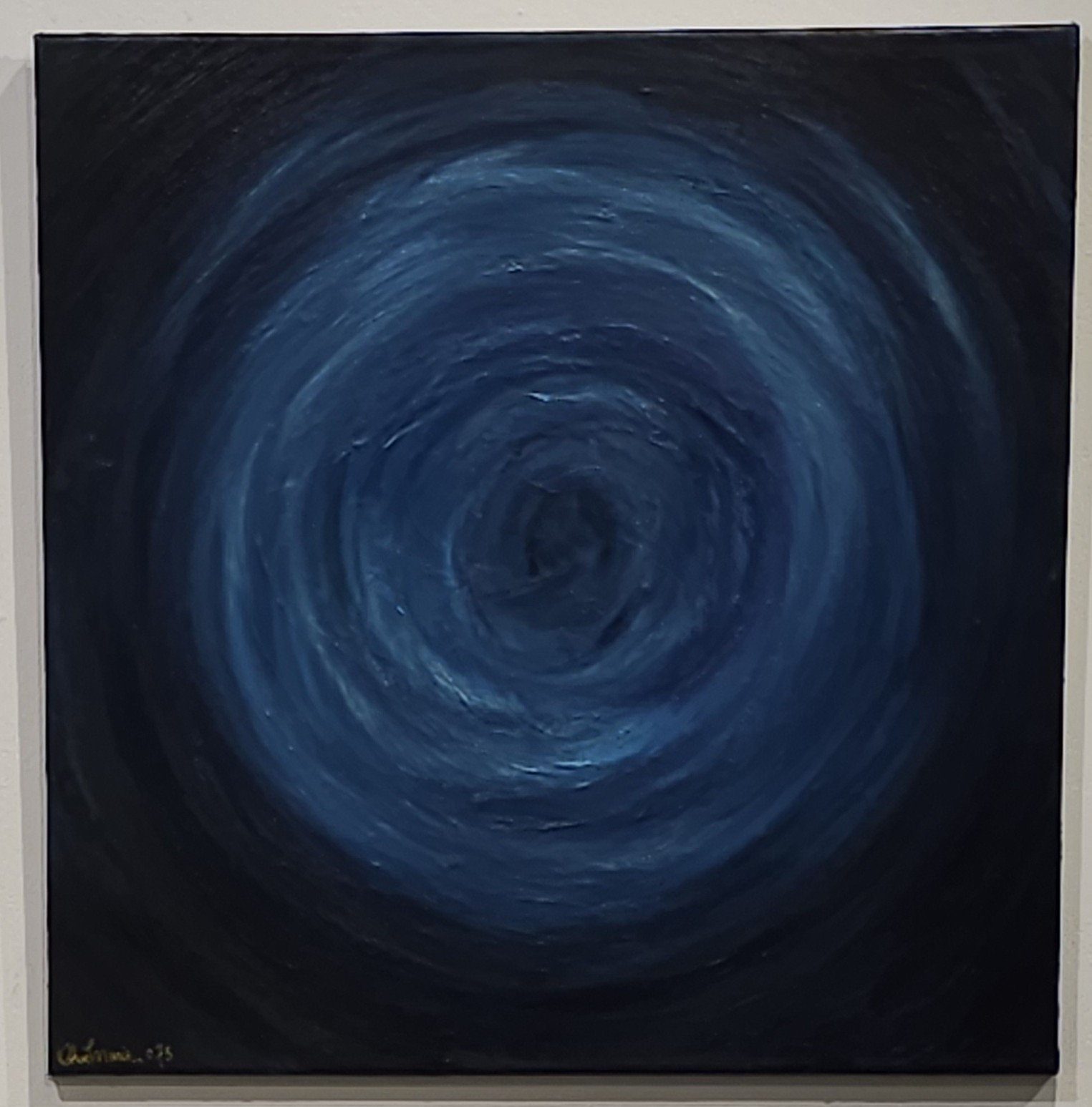 Dark blue abstract spiral painting with swirling circular brushstrokes on a black background