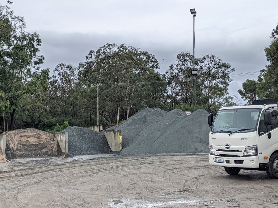Truck Parked Near Piles of Gravel — Cessnock Landscaping Supplies In Cessnock, NSW