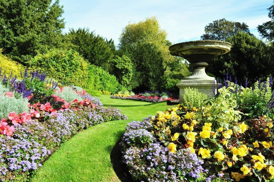 A Vibrant Garden Path Winds Through Colorful Flower Beds — Cessnock Landscaping Supplies In Cessnock, NSW