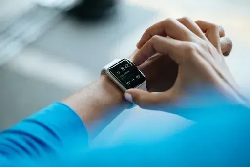 A person is wearing an apple watch on their wrist.