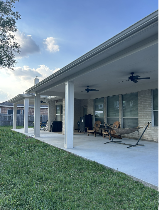 A large house with two garage doors in a residential neighborhood.