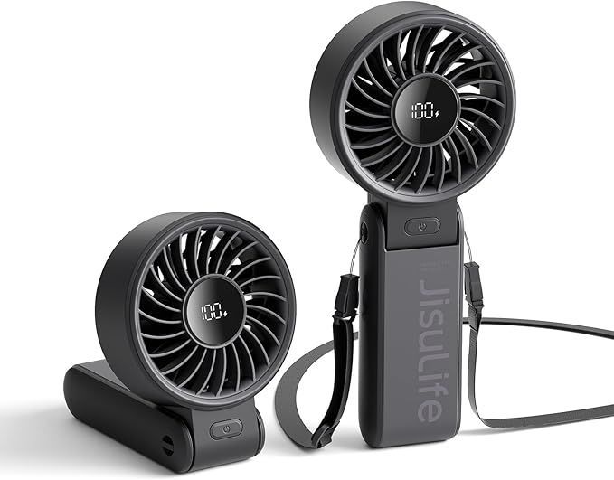 Two black handheld fans are sitting next to each other on a white surface.