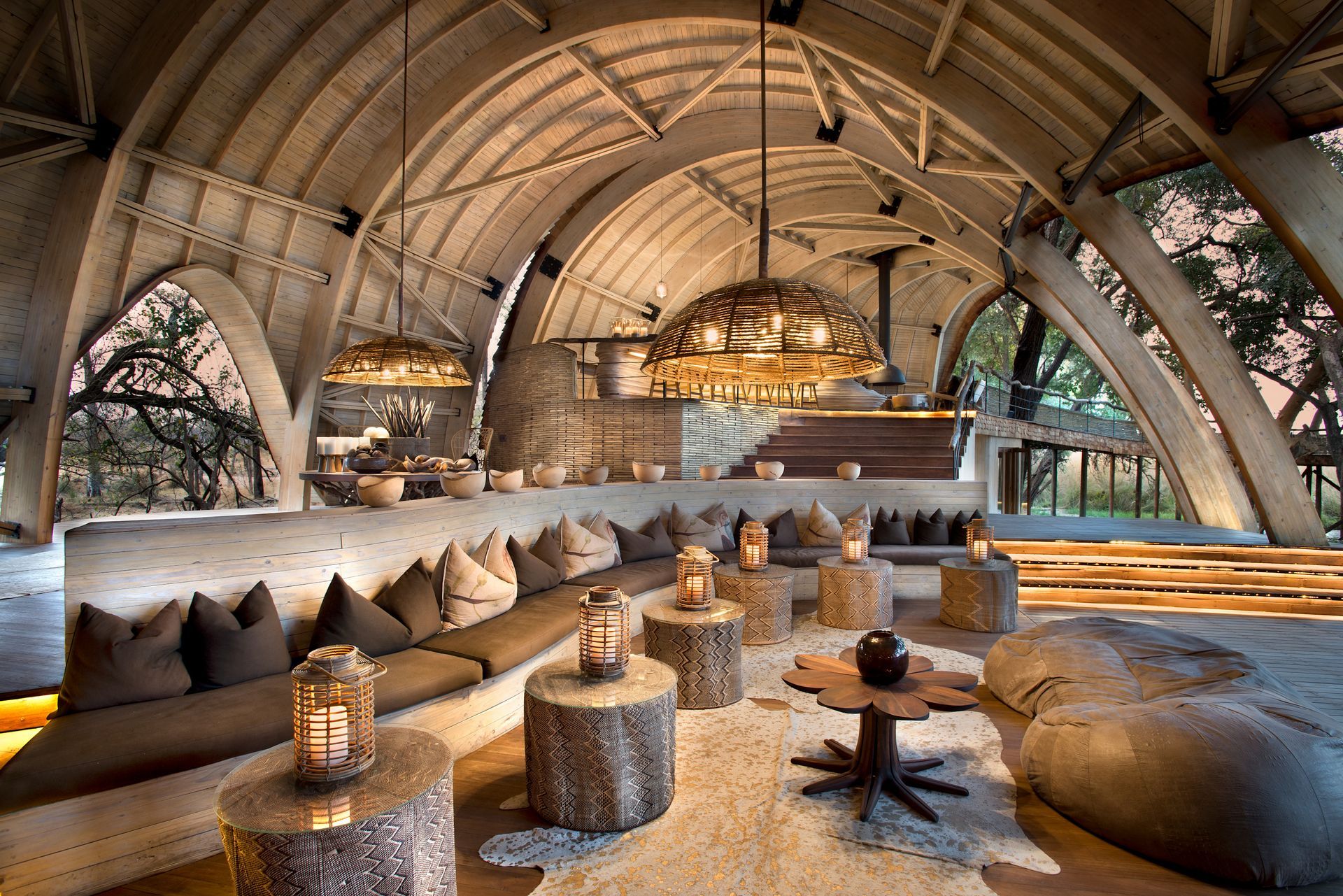 A large room with a lot of furniture and tables in a lodge in Africa.