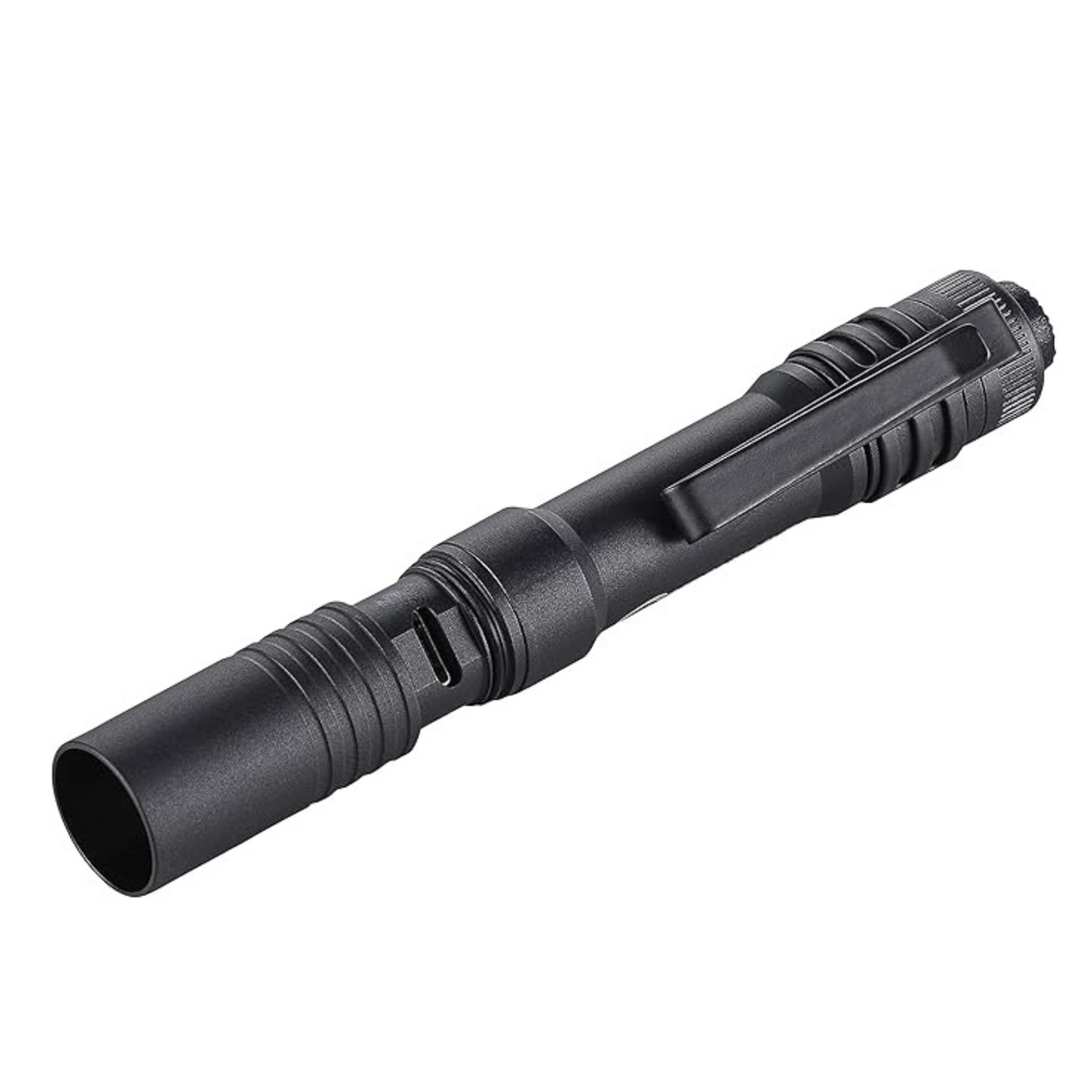 A black flashlight is sitting on a white surface.