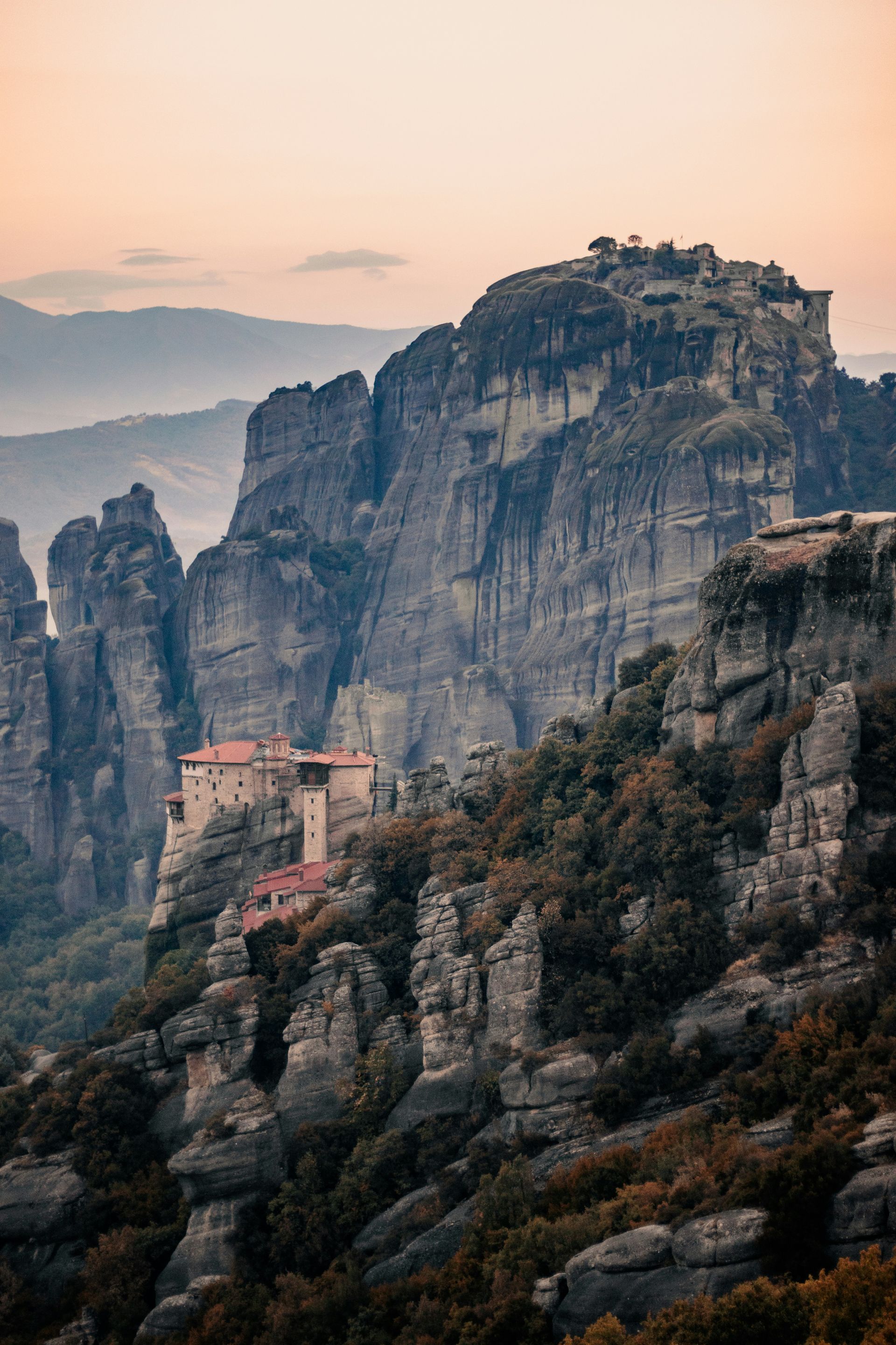The Meteora Monastery is sitting on top of a rocky mountain in Kalabaka, Greece.
