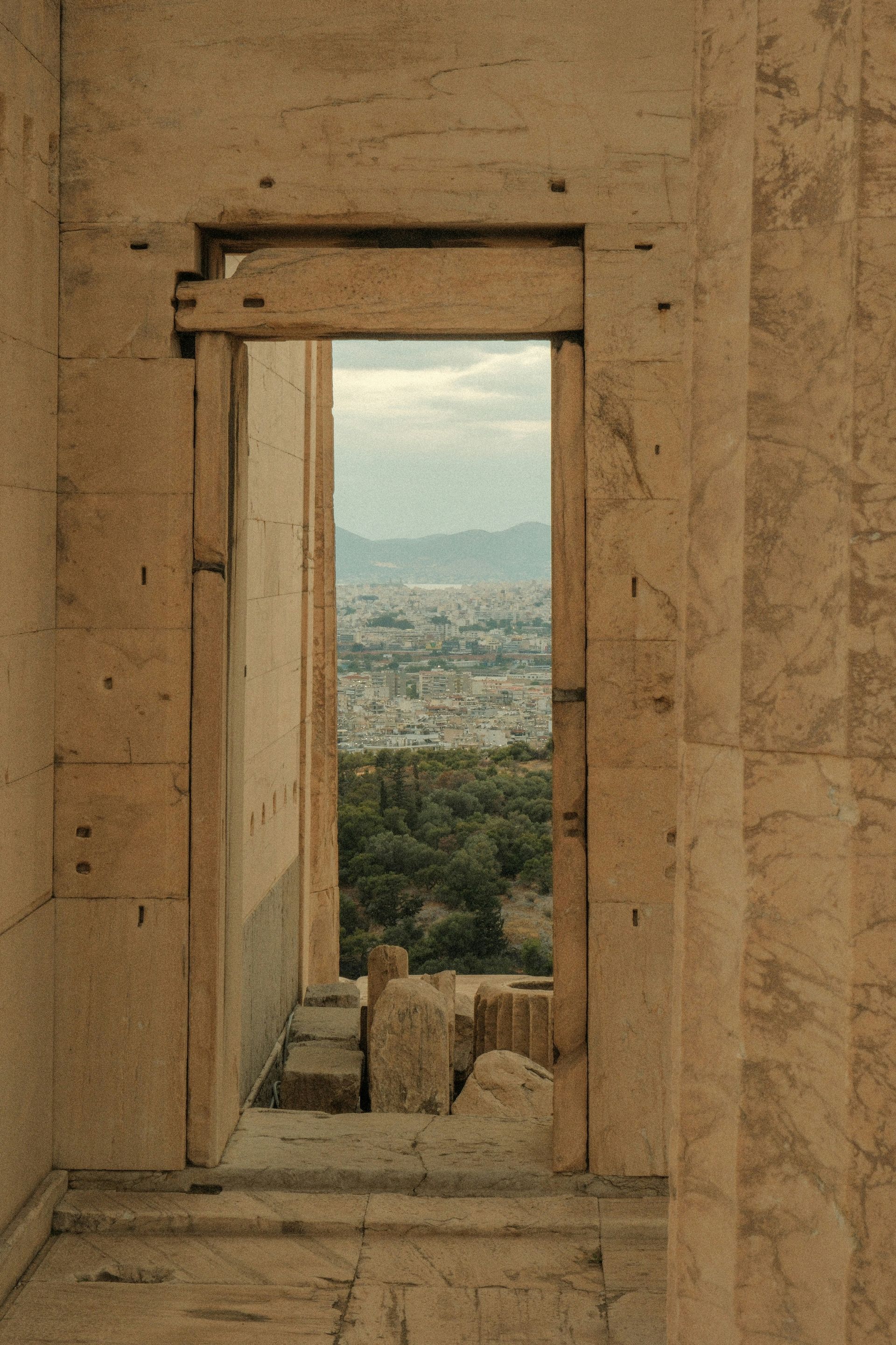A doorway in a building with a view of Athens, Greece.