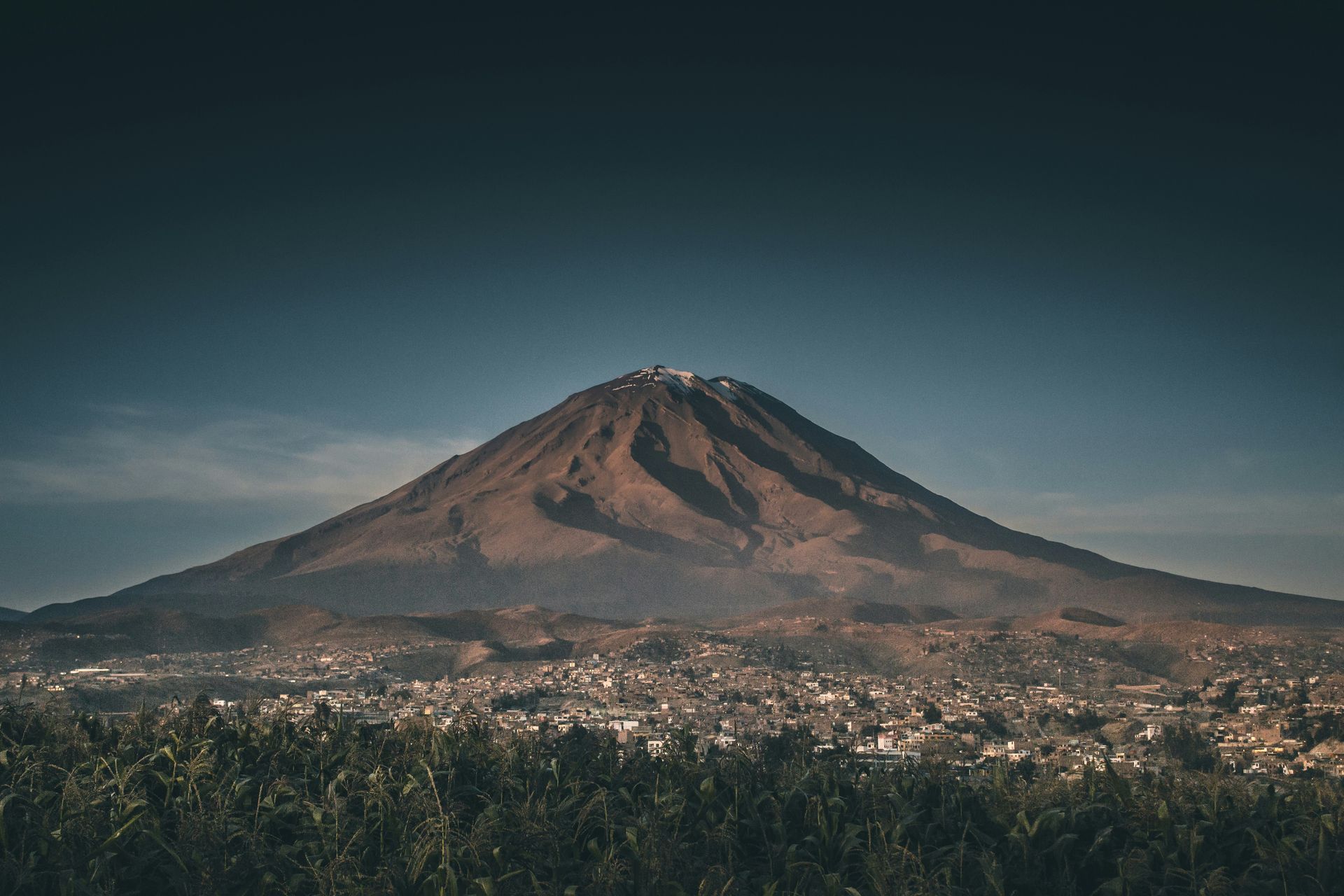 The El Misti Volcano in the background with a city in the foreground in Arequipa, Peru.
