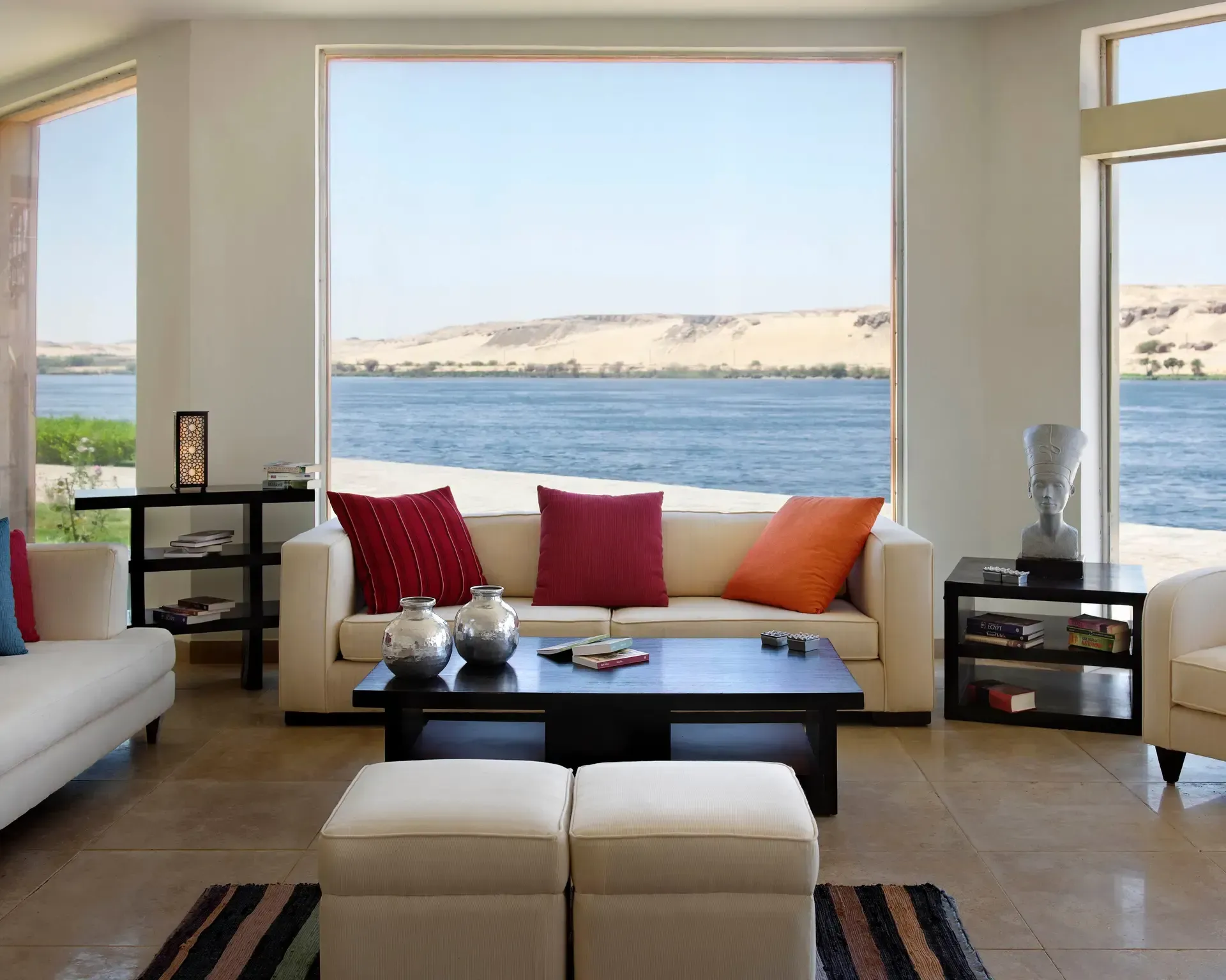 A living room with a view of the ocean on Abercrombie & Kent's Sun Boat III.