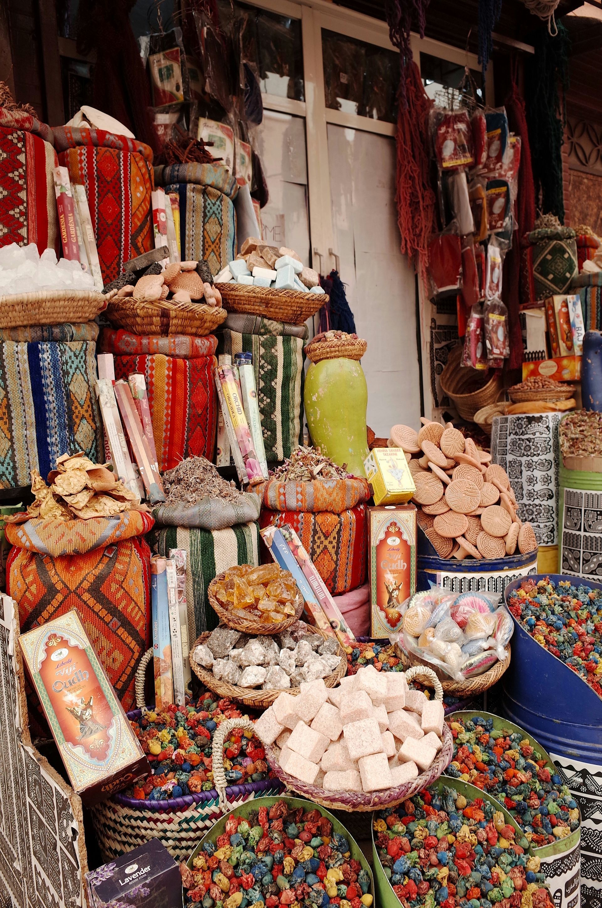 A market filled with lots of different types of food and candy in Marrakesh, Morocco.