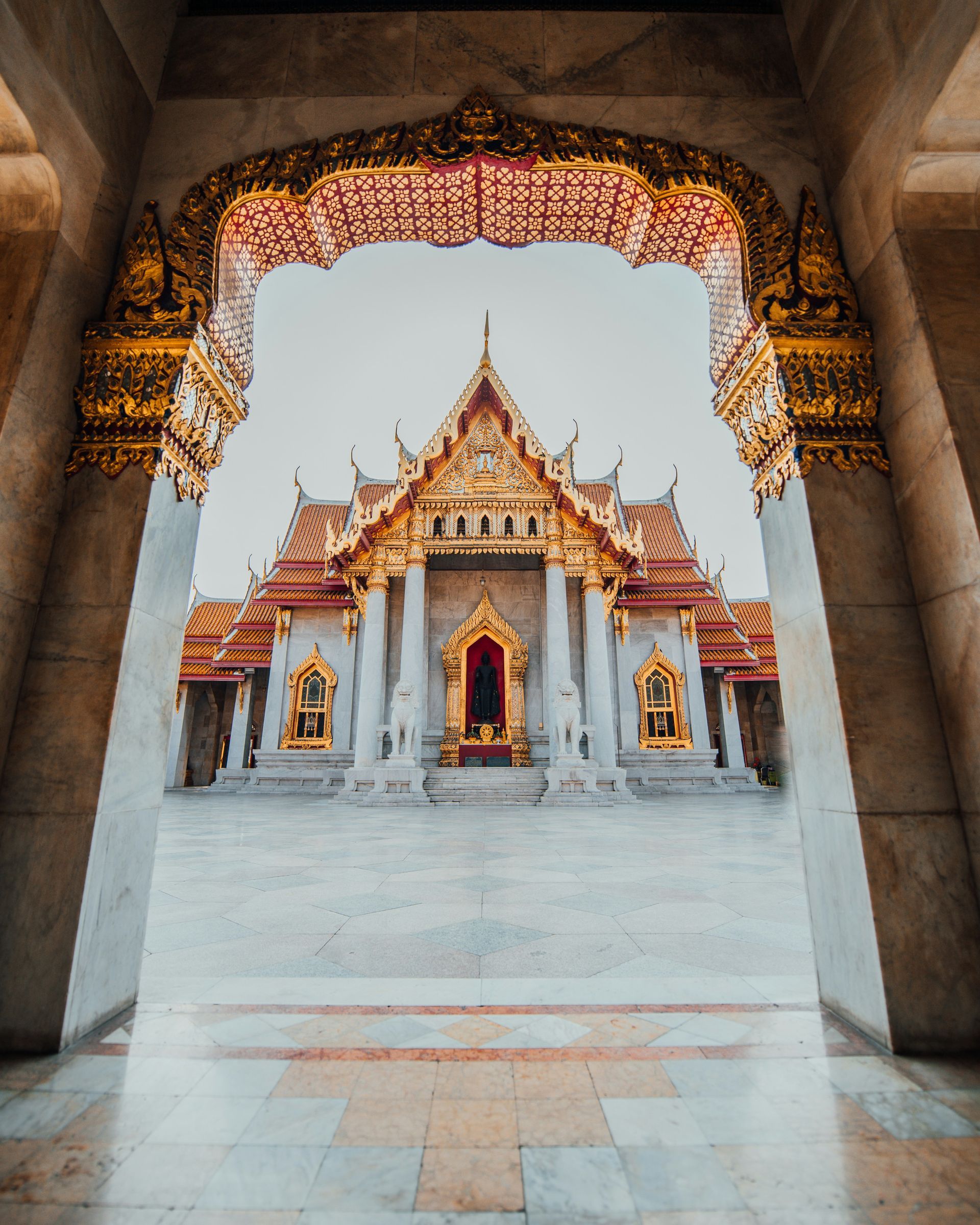 A view of a temple through an archway in Bangkok, Thailand.