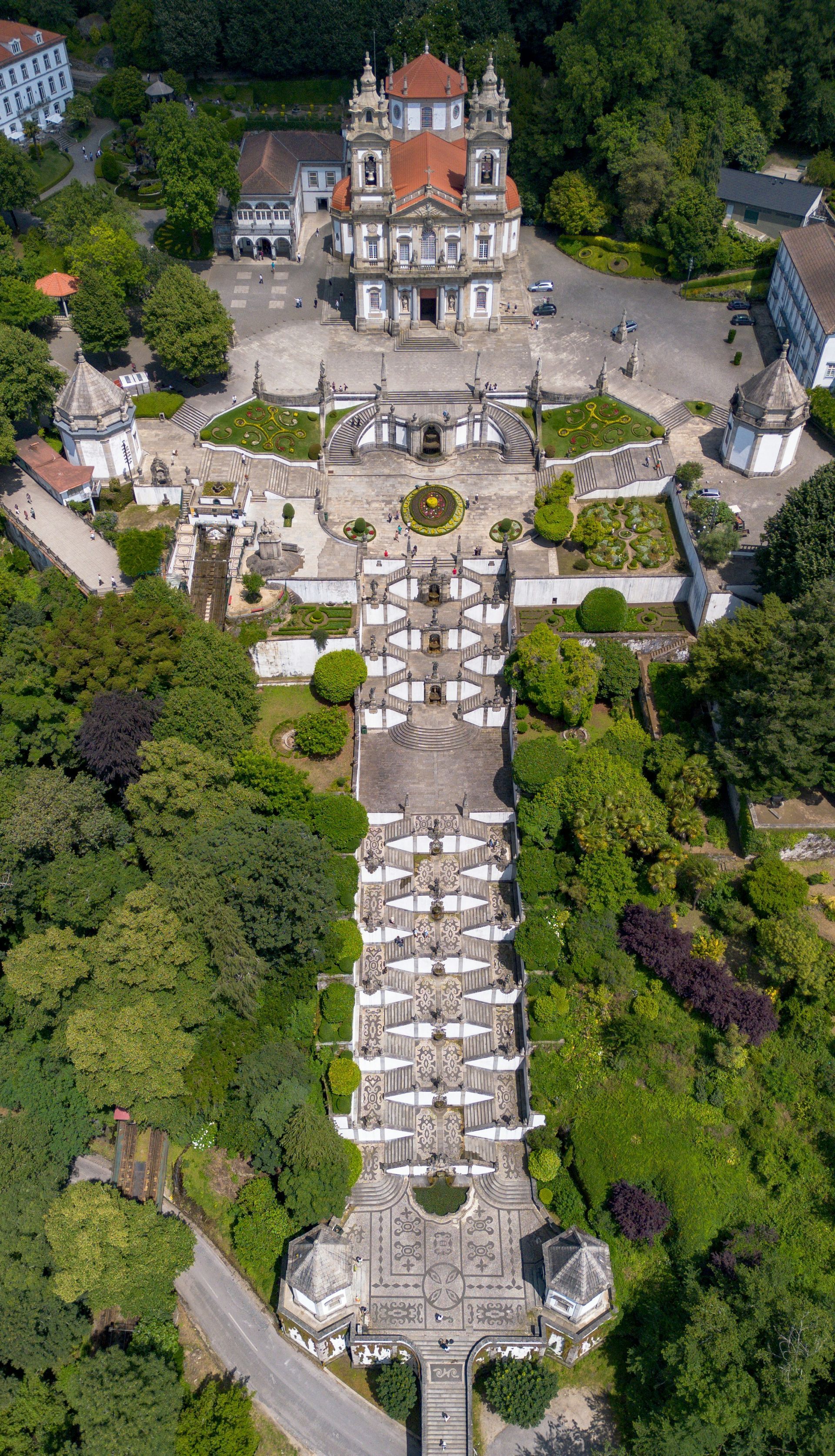 Aerial view of Bom Jesus do Monte sanctuary in Braga, Portugal, with long baroque staircase leading to the church.