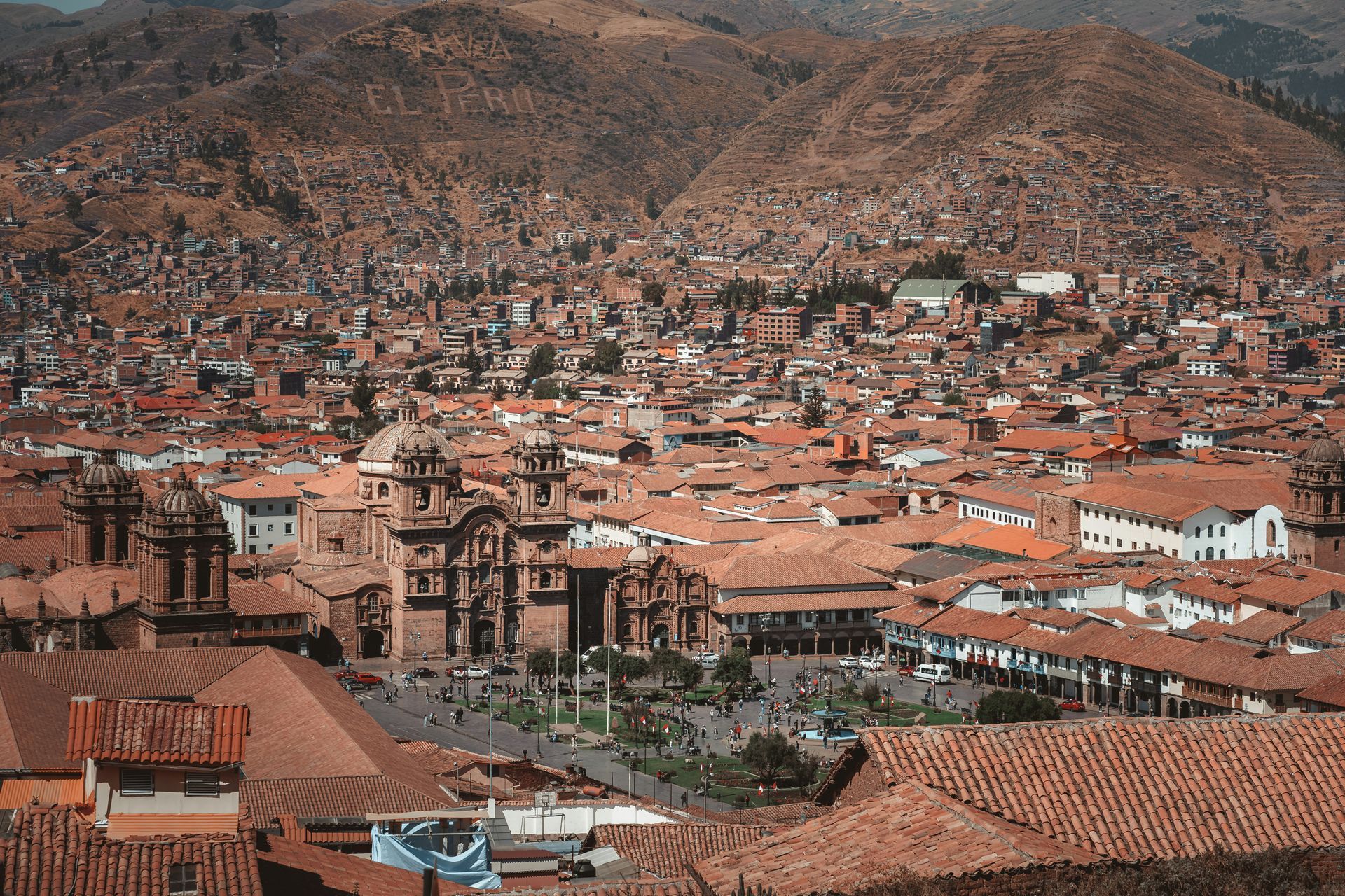An aerial view of Cusco, Peru with mountains in the background.