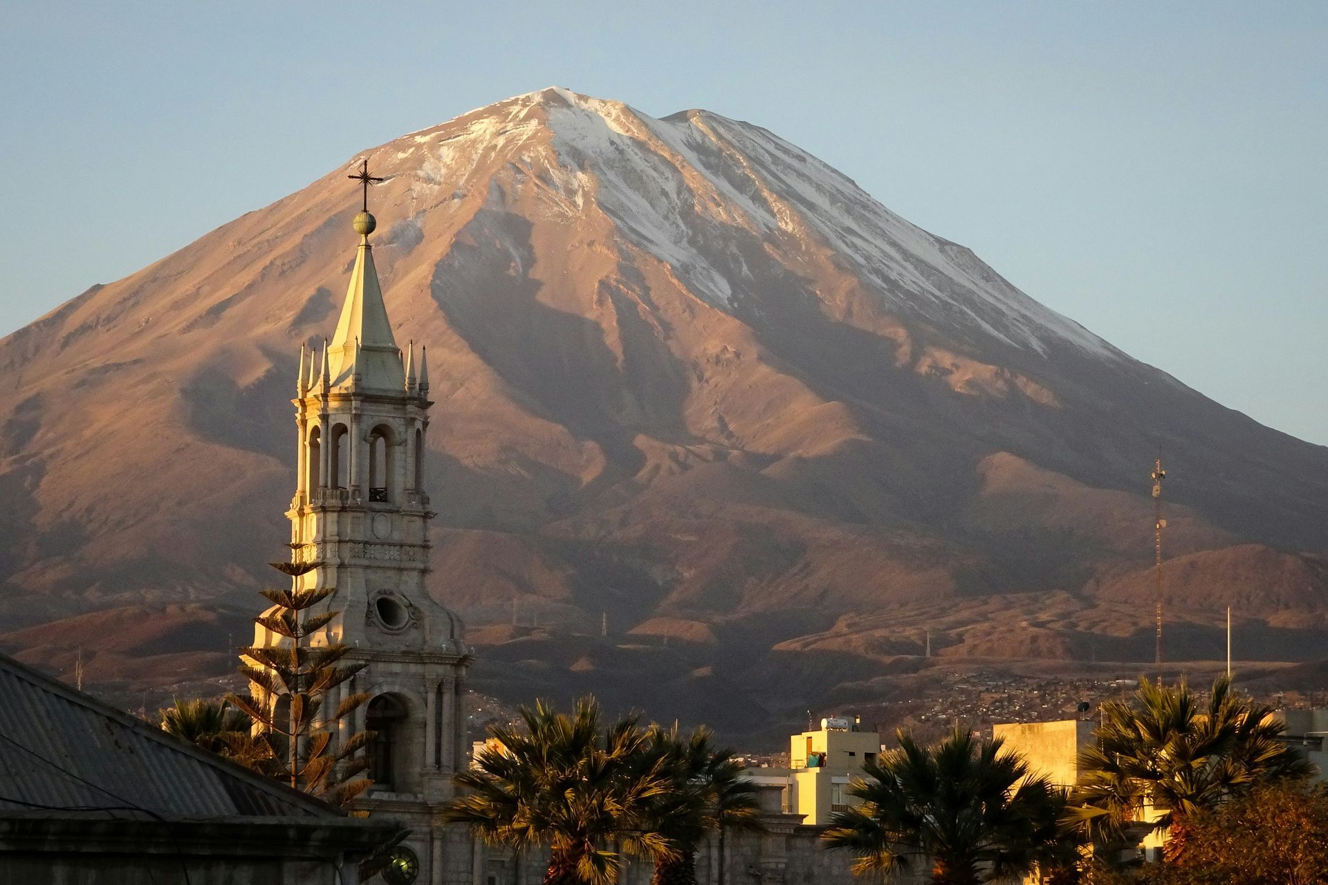 A church in front of The El Misti Volcano with snow on it in Arequipa, Peru.