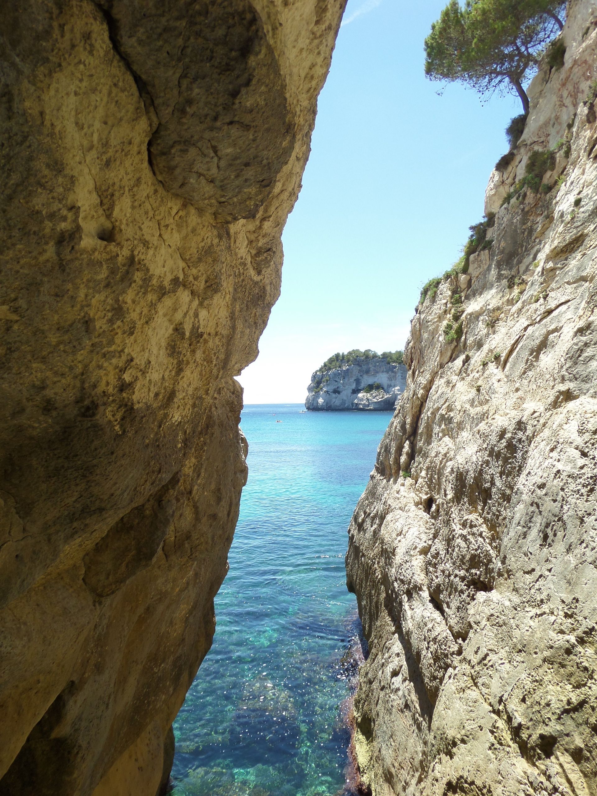 A view of the ocean from a rocky cliff in Menorca, Spain.
