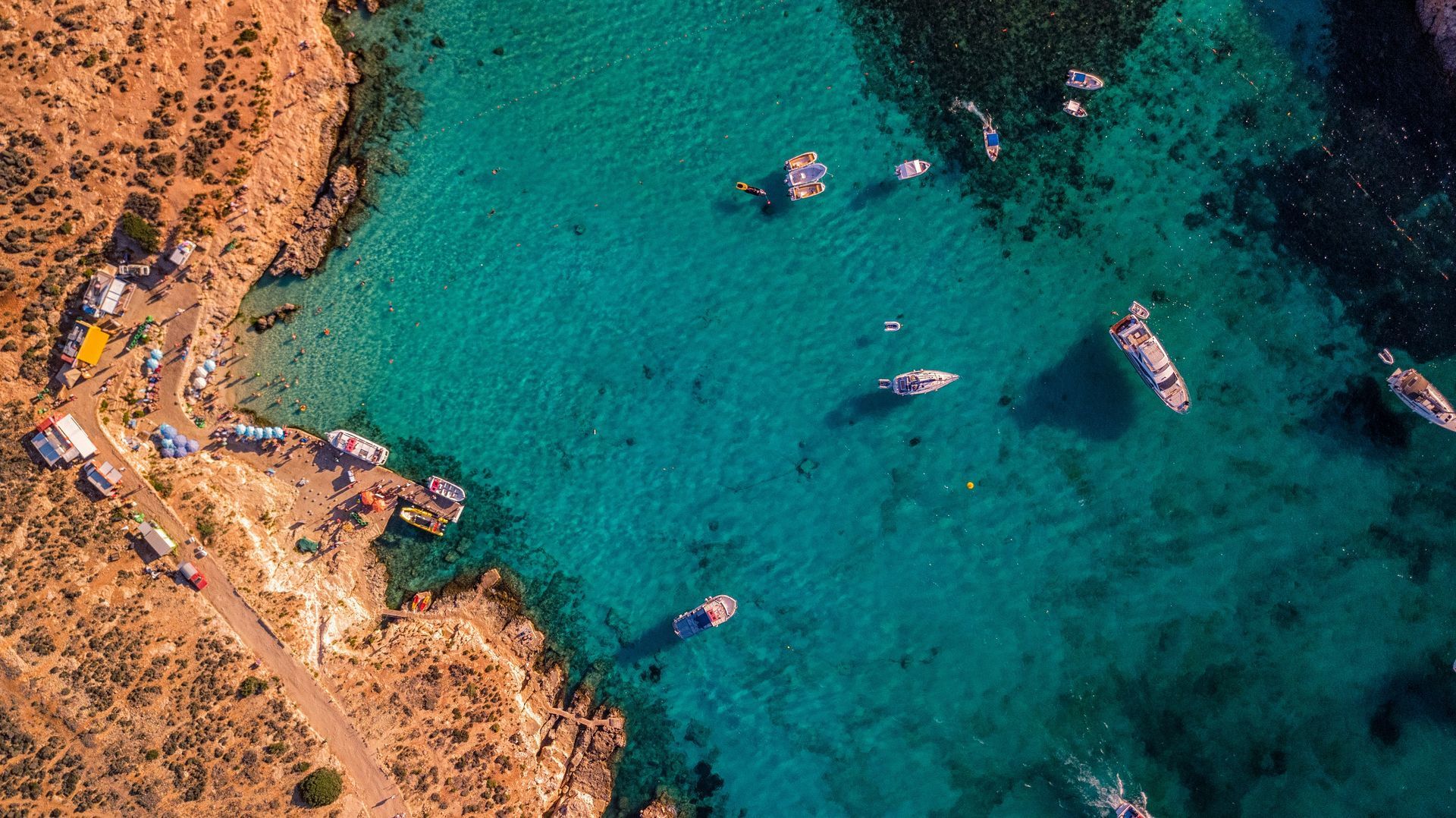 An aerial view of a body of water with boats in it in Malta.