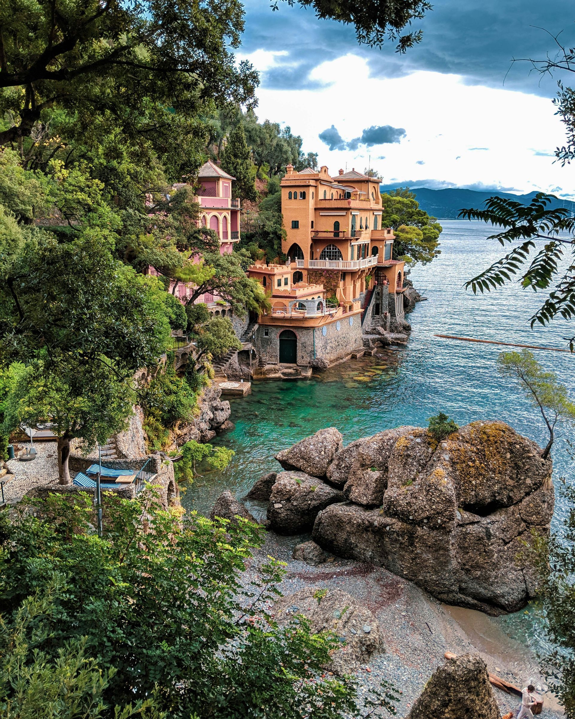 There is a house on the cliff overlooking the ocean in Portofino, Italy.
