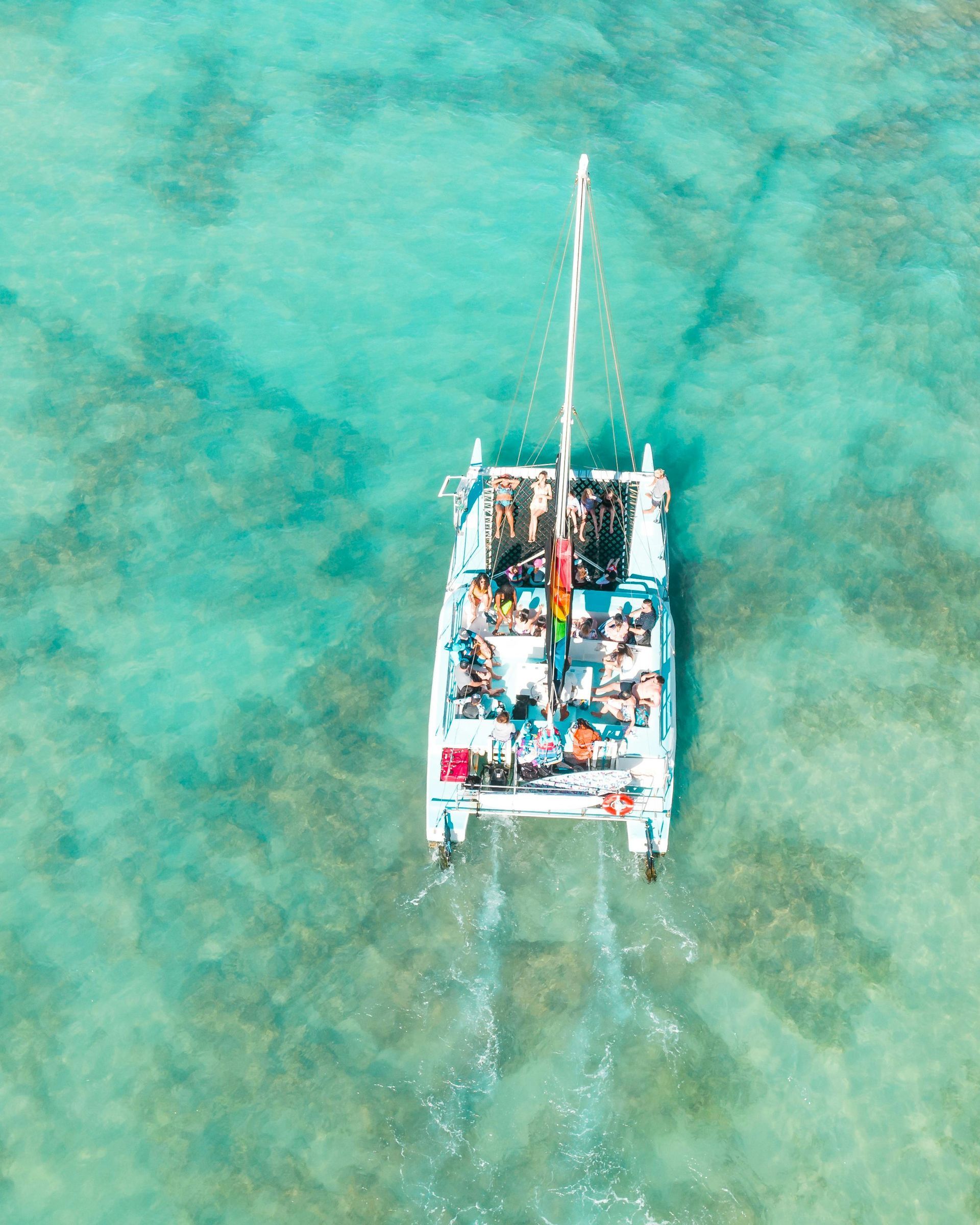 An aerial view of a catamaran in the ocean in Cancun.