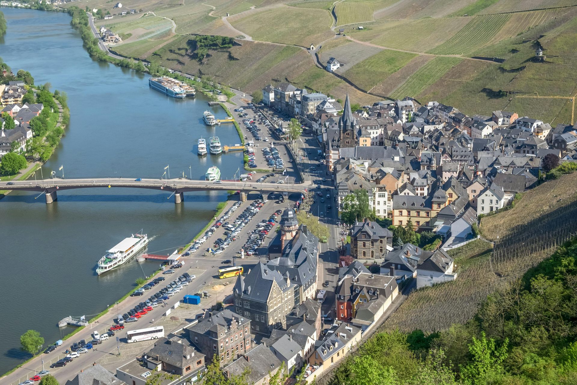 An aerial view of Bernkastel, Germany next to a river.