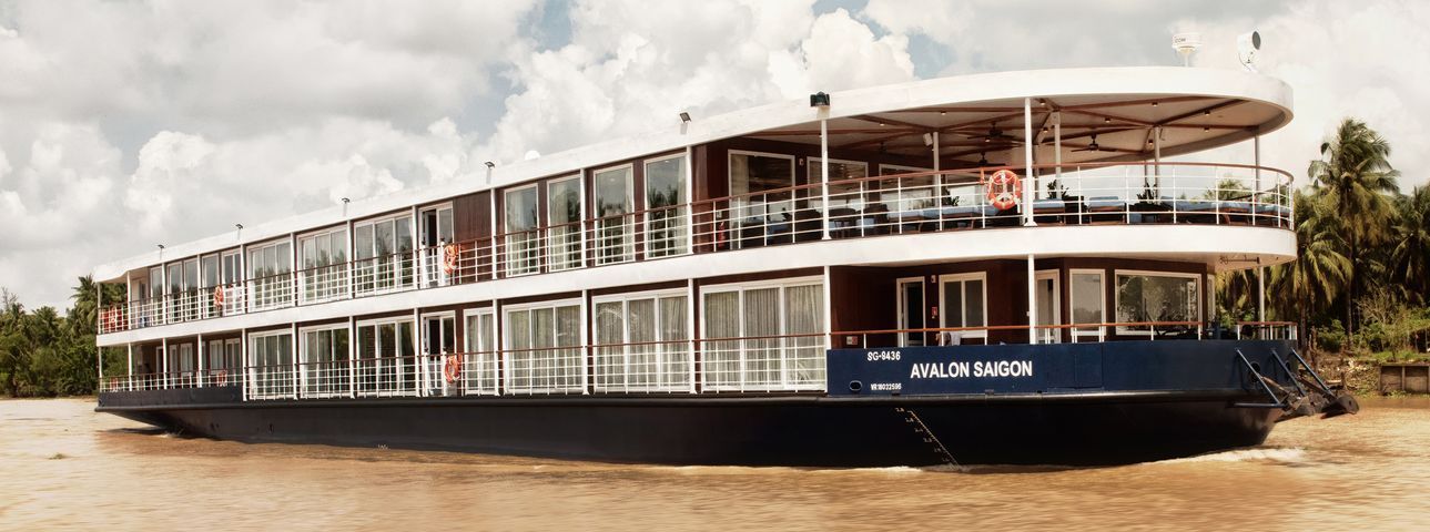 The Avalon Saigon cruise ship is floating on top of the Mekong River.