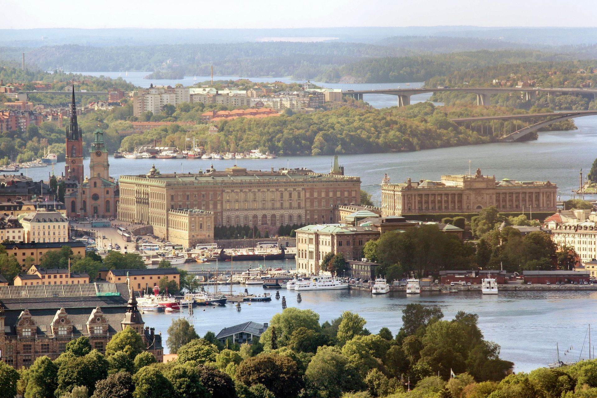 An aerial view of Stockholm and The Royal Palace surrounded by water and trees