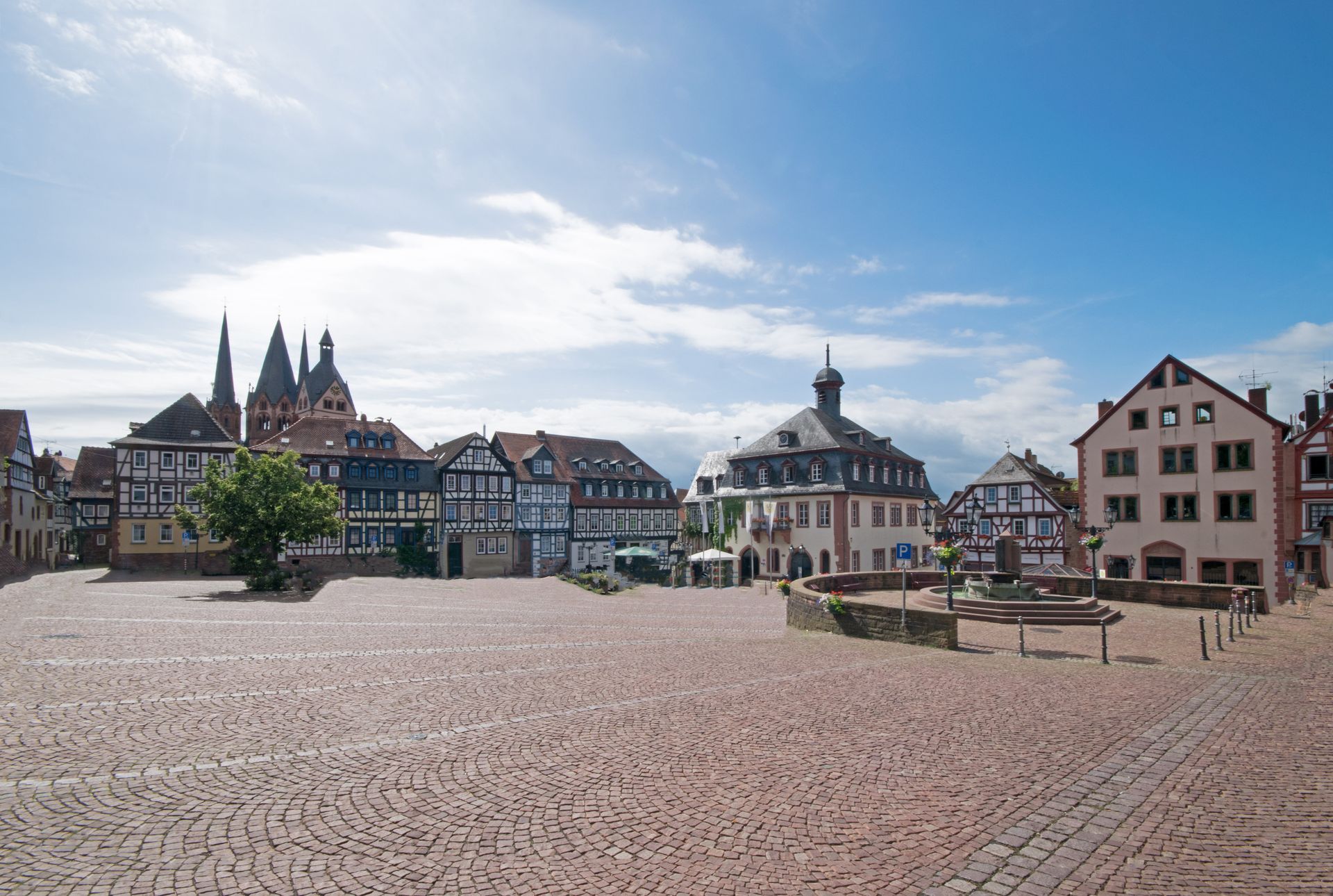 A brick square Gelnhausen, Germany with buildings in the background.