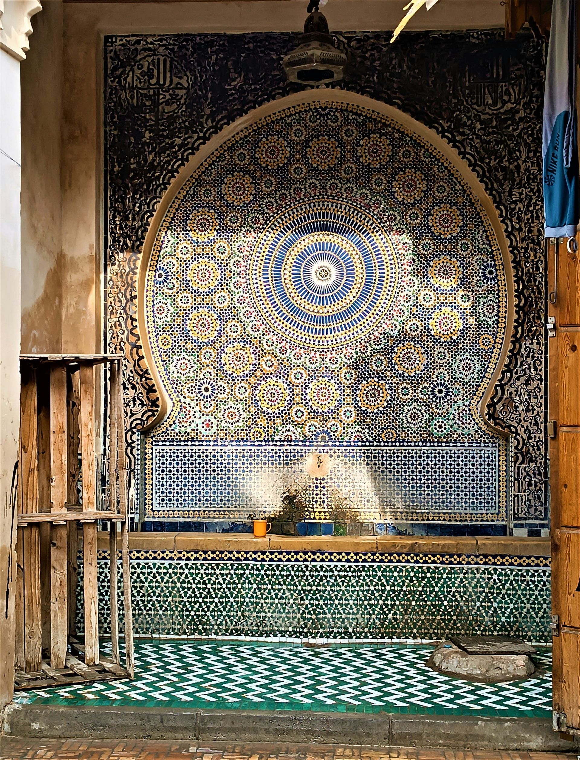 There is a fountain in the middle of the room in Fes, Morocco.