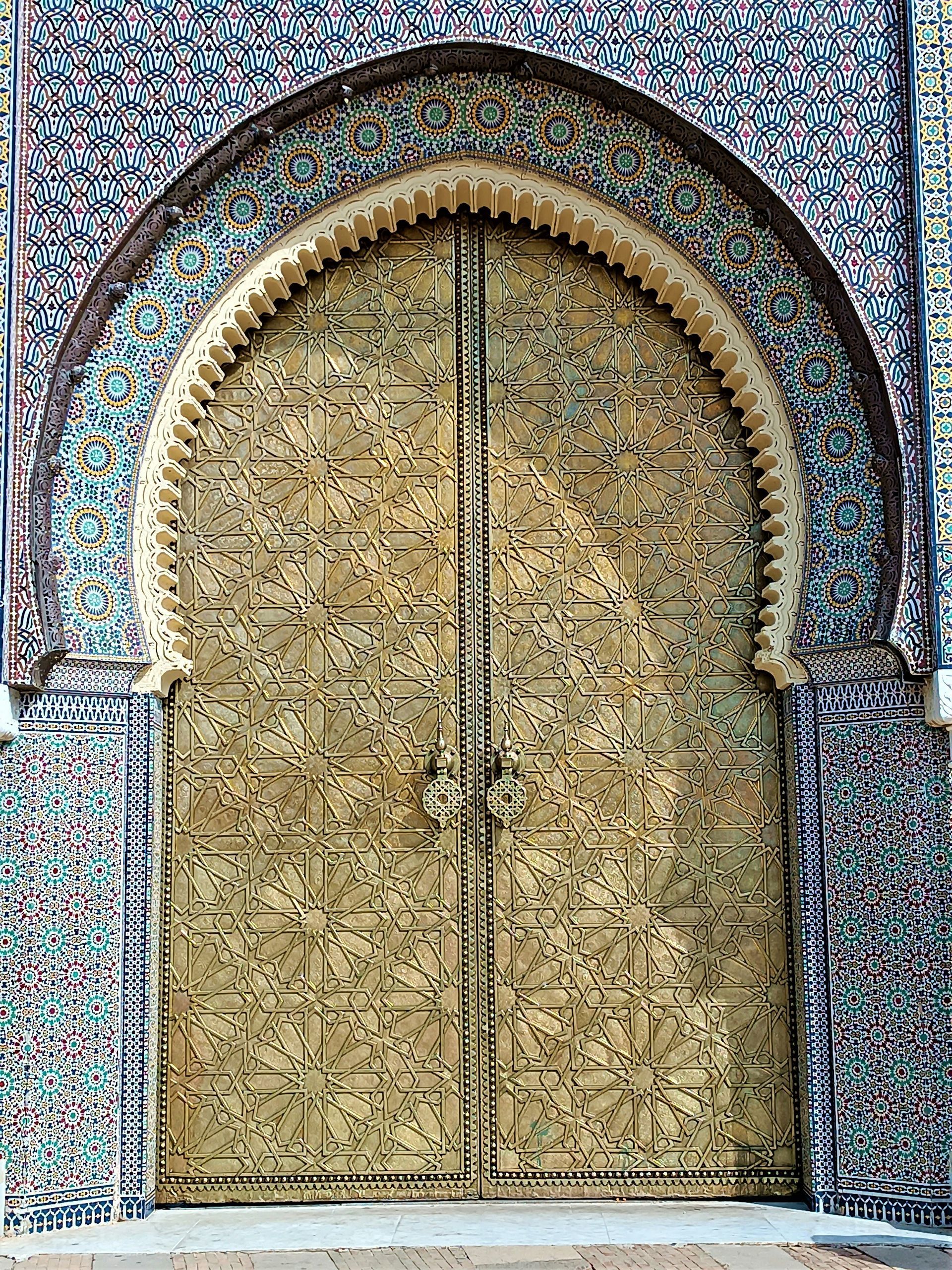 A close up of a door on a building with a pattern on it in Fes, Morocco.
