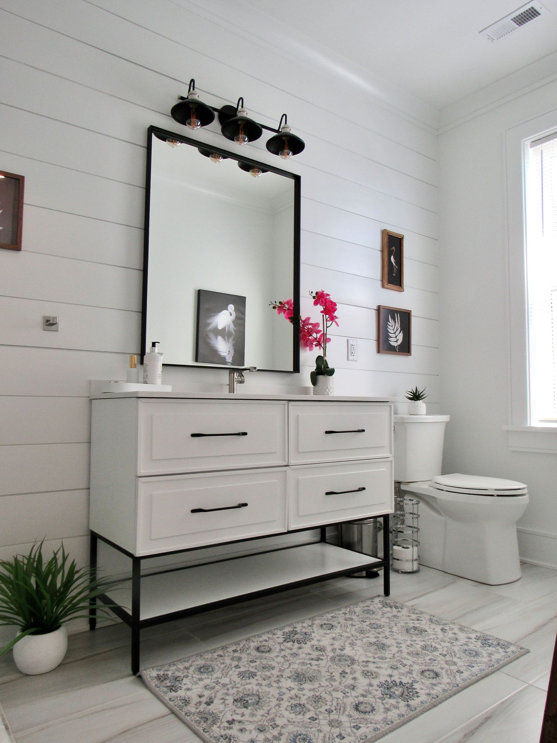 Bathroom mirror Coastal-style living room in a custom Delaware home