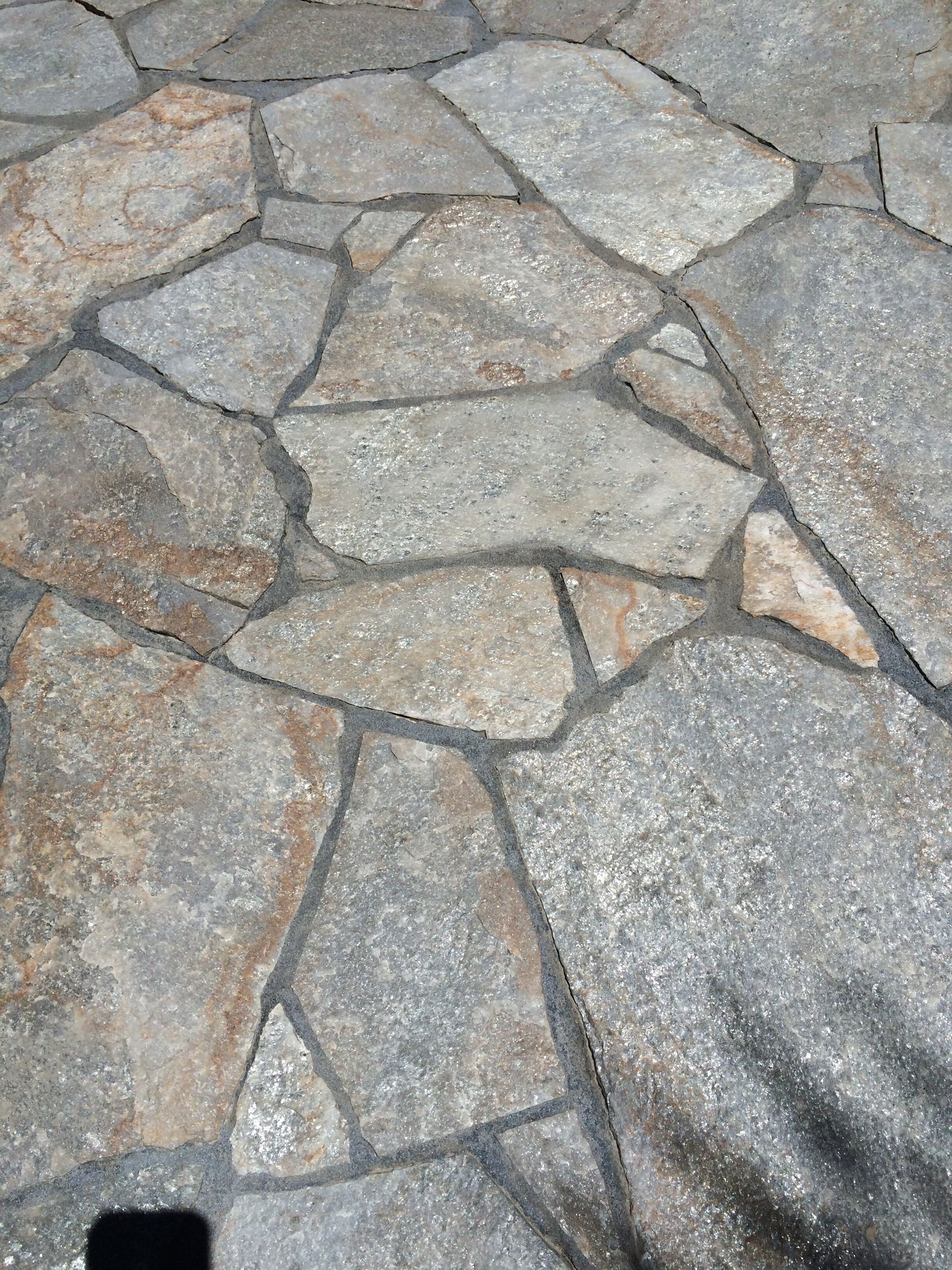 A close up of a patio with a lot of rocks on it.