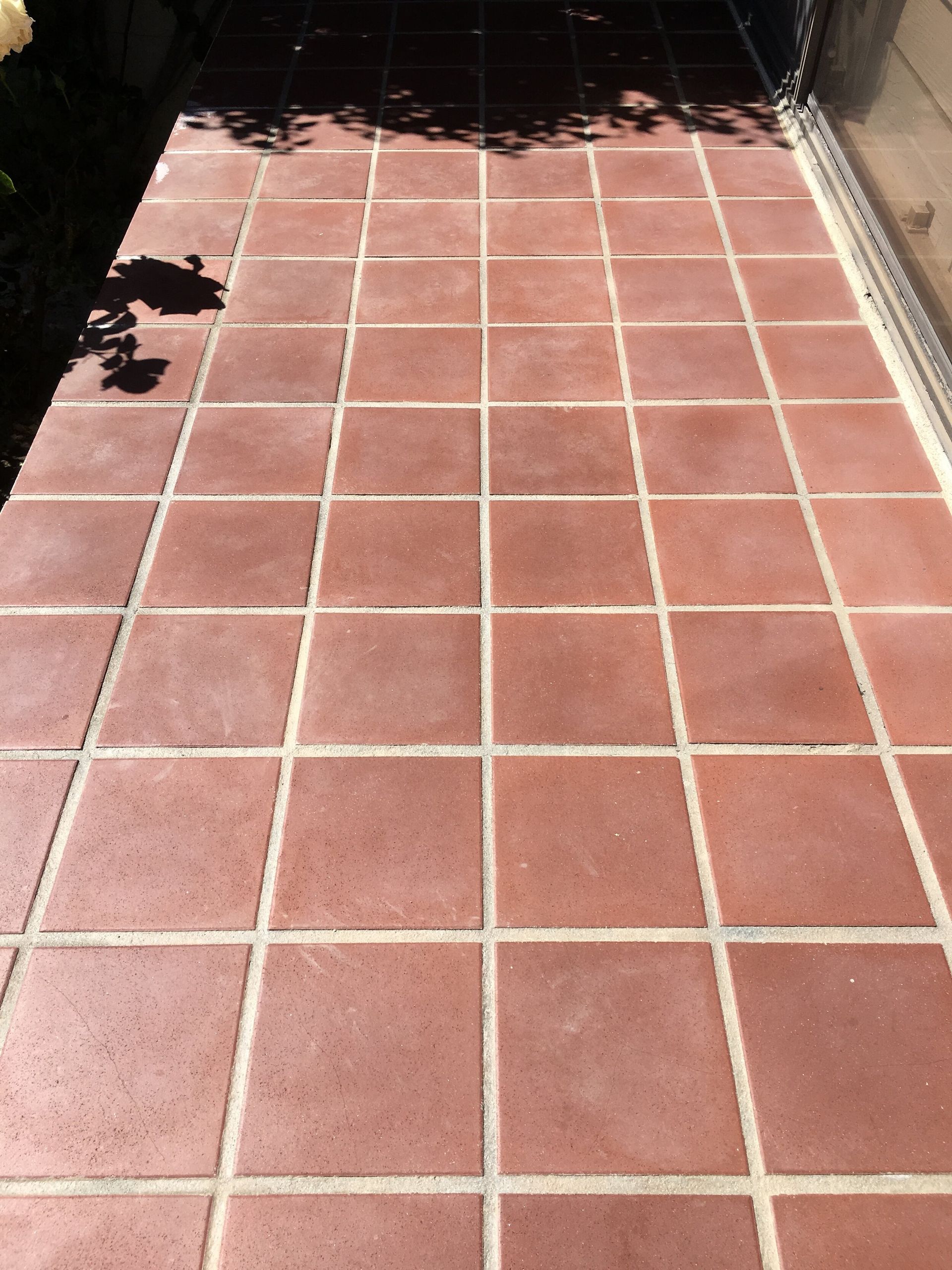 A red tiled floor with white lines on it