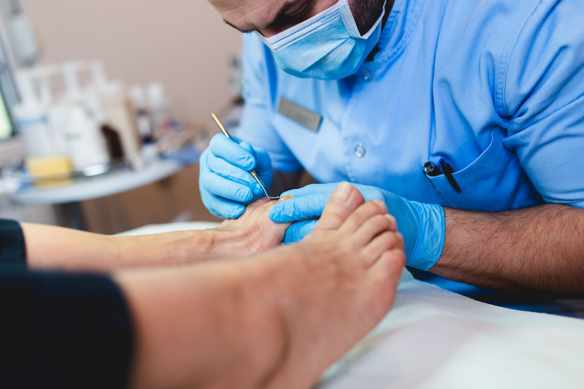 Podiatrist showing custom insole and foot model for podiatry orthotic supplies demonstration.