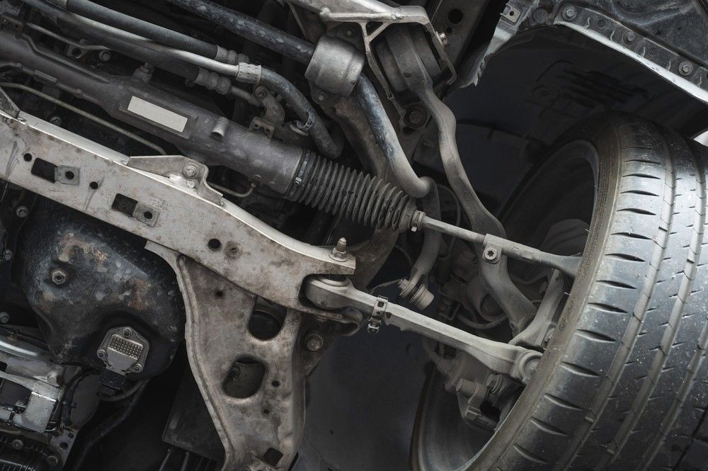 A Close Up Of The Underside Of A Car With A Tire — Bay City Quality Mobile Mechanic In Pialba, QLD