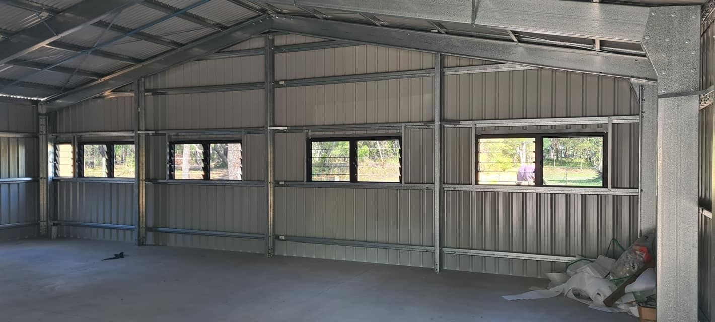 The Inside Of A Metal Shed With A Lot Of Windows — Bushman Sheds in Bundaberg East, QLD